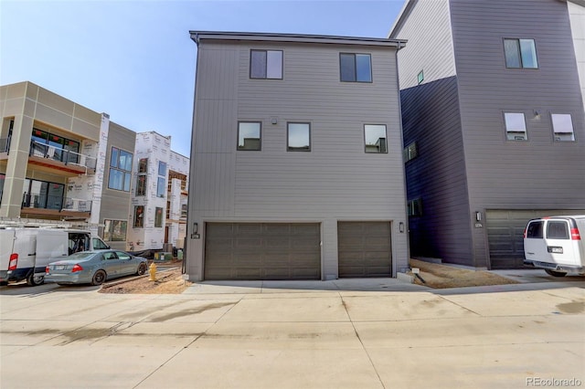 exterior space with an attached garage and concrete driveway