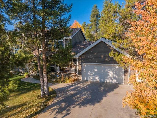 view of front of house with a garage and a front yard