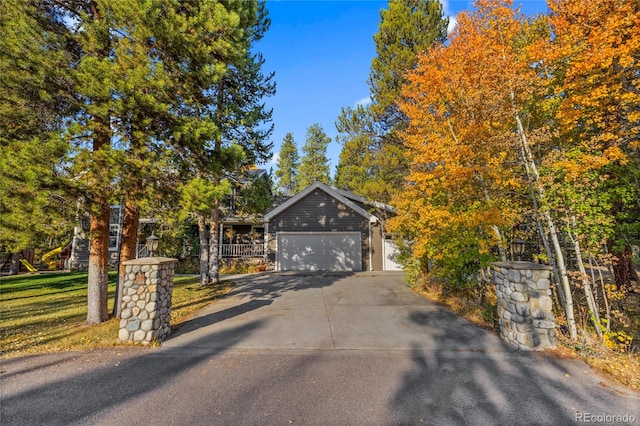 view of front of property with a garage and a front yard