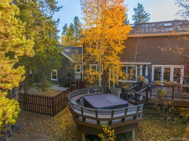 back of house with a wooden deck