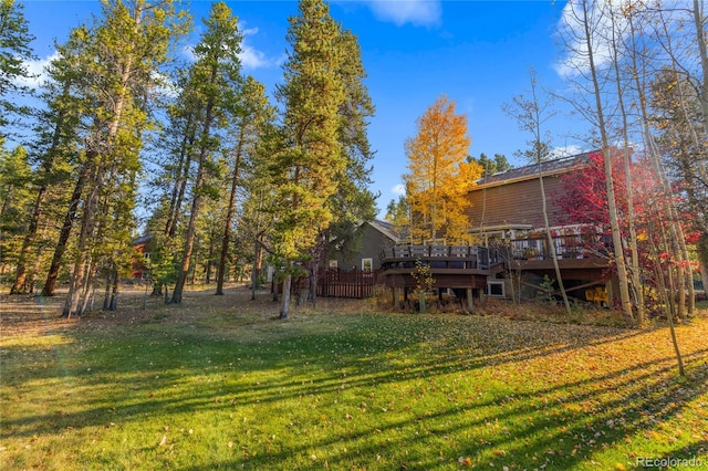 view of yard with a wooden deck