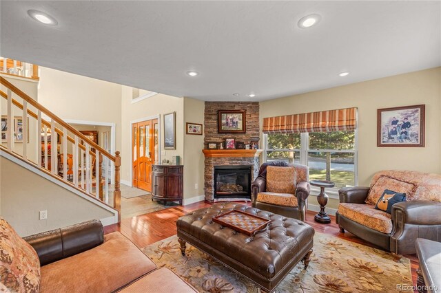 living room with a fireplace and light hardwood / wood-style flooring