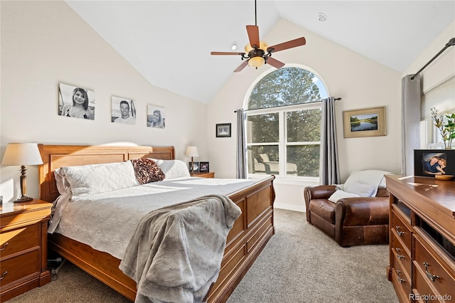 carpeted bedroom featuring vaulted ceiling and ceiling fan