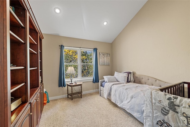 bedroom featuring light carpet and lofted ceiling