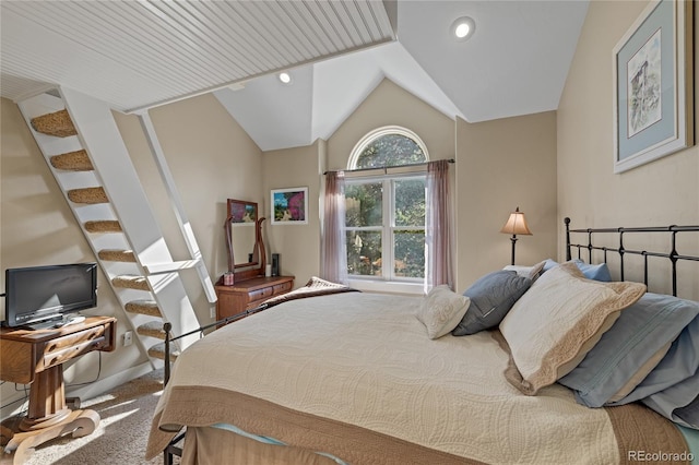 bedroom featuring lofted ceiling and carpet floors