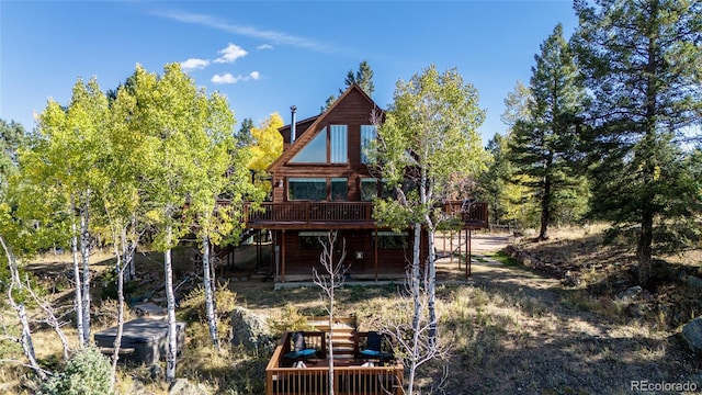 rear view of property with a deck