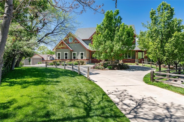 view of front facade featuring a garage and a front lawn