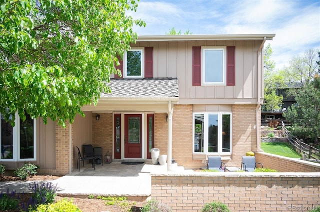 view of front facade featuring a porch and brick siding