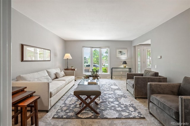 living area featuring carpet flooring and plenty of natural light