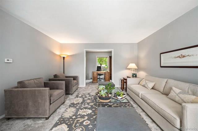 living room with light colored carpet and baseboards