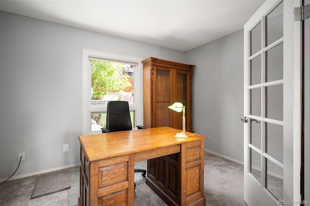 carpeted office with baseboards