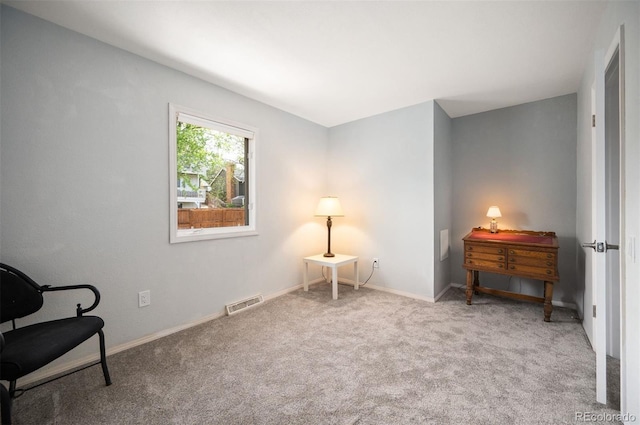 sitting room with carpet floors and baseboards