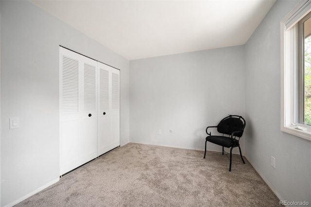 unfurnished room with carpet, plenty of natural light, and baseboards