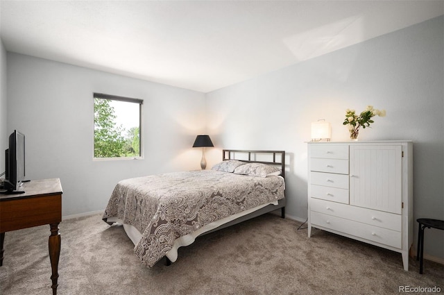 bedroom with carpet and baseboards