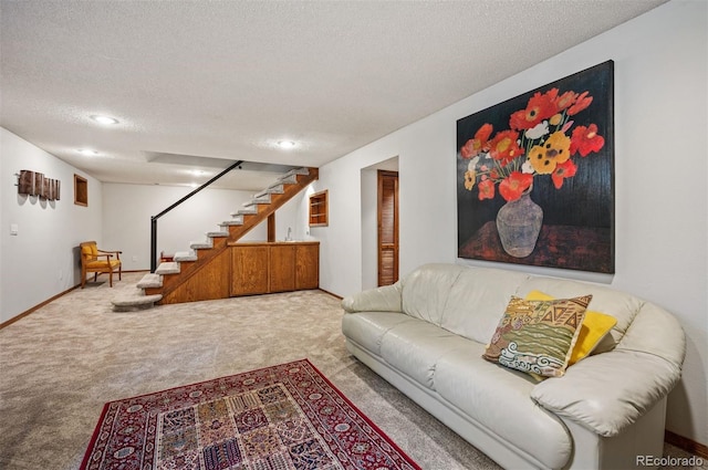 carpeted living area featuring stairway, a textured ceiling, baseboards, and recessed lighting