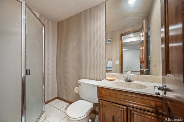 full bathroom featuring wallpapered walls, a stall shower, tile patterned floors, toilet, and vanity