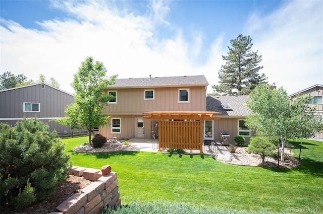 back of house featuring a patio, a yard, board and batten siding, and roof with shingles