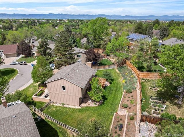 aerial view of property and surrounding area with a mountain backdrop