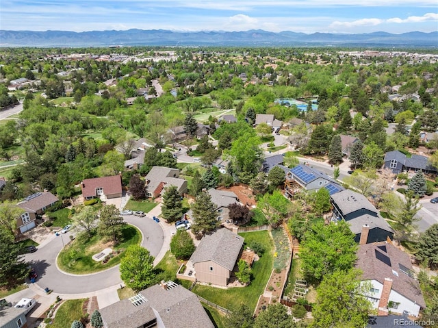 aerial view of property's location featuring mountains and nearby suburban area
