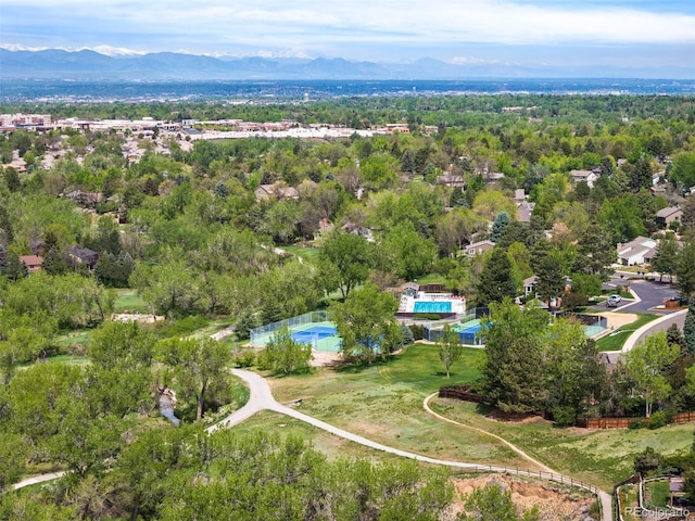 aerial overview of property's location with a pool area and mountains