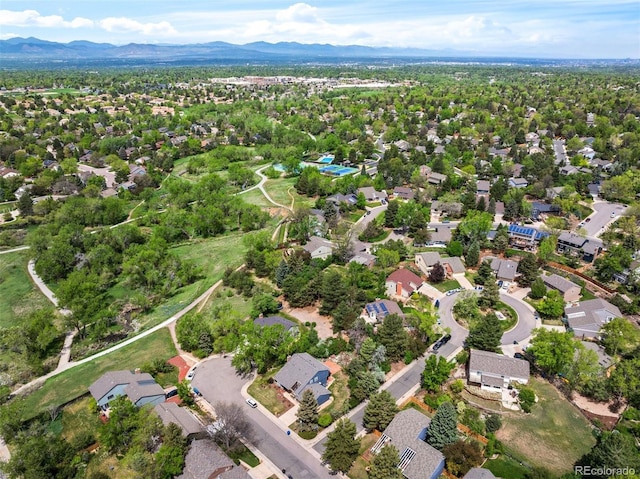 view of property location with a mountainous background and nearby suburban area