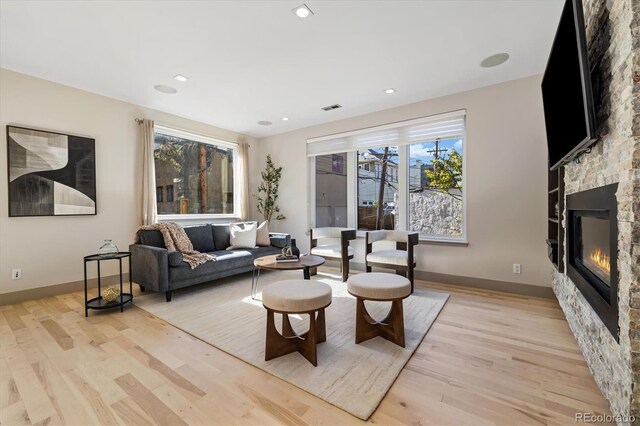 3615 Navajo St, Denver, CO 80211 - living room featuring light wood-style floors, a fireplace, baseboards, and recessed lighting