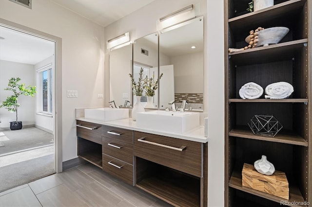 3615 Navajo St, Denver, CO 80211 - bathroom featuring double vanity and baseboards