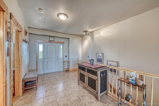 2680 Wild Bill Blvd, Westcliffe, CO 81252 - entrance foyer featuring a textured ceiling and a textured wall