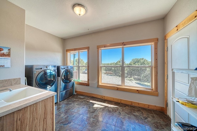 2680 Wild Bill Blvd, Westcliffe, CO 81252 - laundry area featuring washer and clothes dryer and stone finish flooring