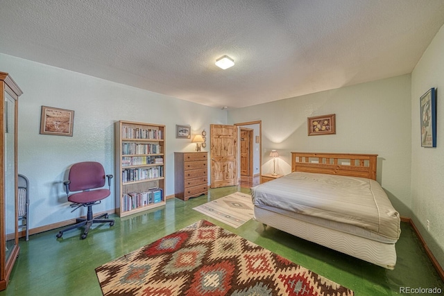 2680 Wild Bill Blvd, Westcliffe, CO 81252 - bedroom featuring baseboards and a textured ceiling