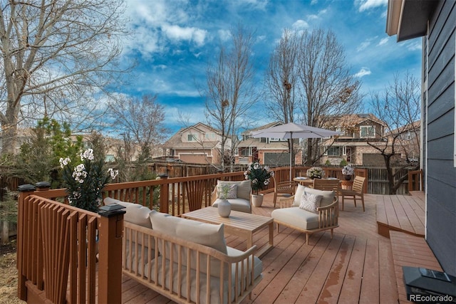 deck featuring a residential view and an outdoor living space