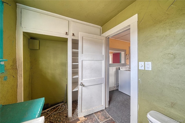 bathroom featuring toilet and tile floors