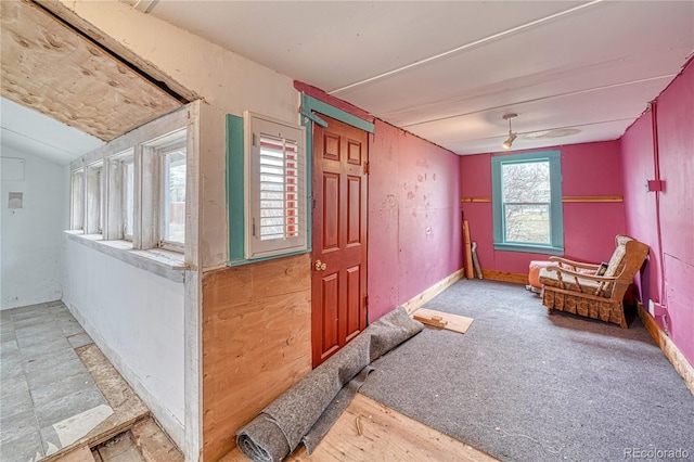 interior space featuring ceiling fan