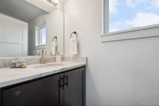 260 Upper Glenway Rd, Palmer Lake, CO 80133 - bathroom featuring vanity and a textured wall