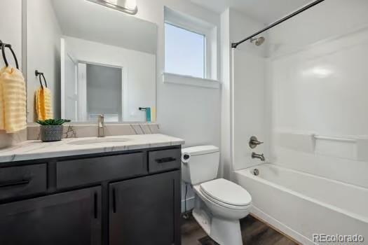 260 Upper Glenway Rd, Palmer Lake, CO 80133 - full bathroom with vanity, shower / bathtub combination, and wood finished floors