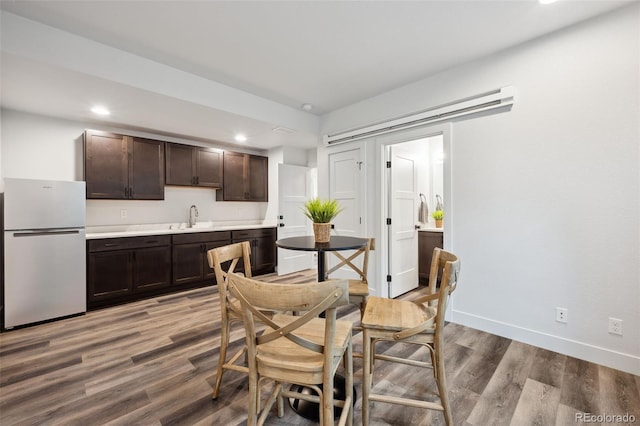 260 Upper Glenway Rd, Palmer Lake, CO 80133 - dining area featuring light wood-style floors, wet bar, and recessed lighting