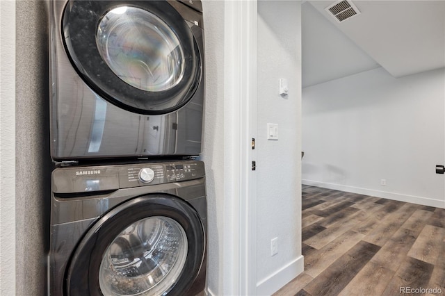 260 Upper Glenway Rd, Palmer Lake, CO 80133 - washroom featuring stacked washer and clothes dryer and wood finished floors