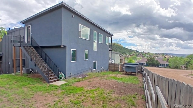 260 Upper Glenway Rd, Palmer Lake, CO 80133 - view of side of property with stairs and stucco siding