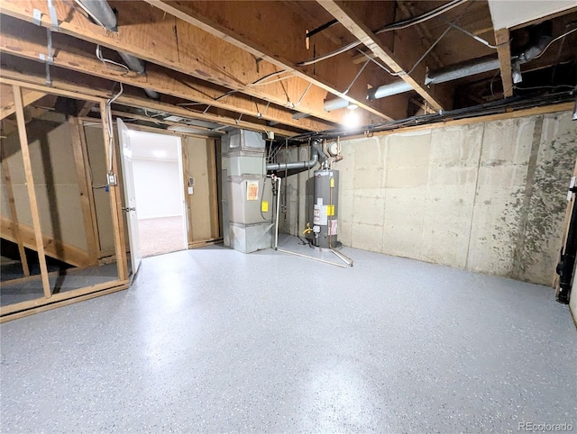 unfinished basement with heating unit and water heater