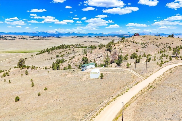 165 Coyotero Trl, Hartsel, CO 80449 - aerial view of sparsely populated area featuring a desert landscape and a mountain backdrop