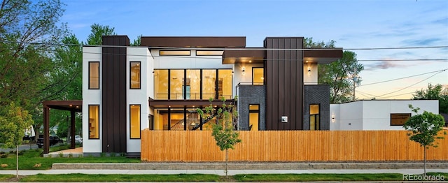 1601 S Columbine St, Denver, CO 80210 - rear view of property with a fenced front yard and a balcony
