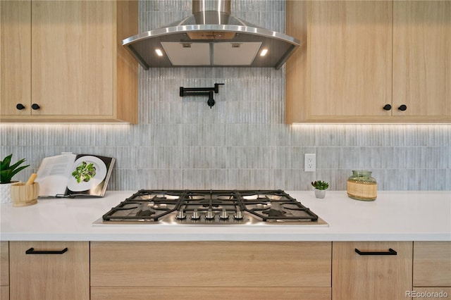 1601 S Columbine St, Denver, CO 80210 - kitchen with ventilation hood, light brown cabinets, light countertops, and stainless steel gas cooktop