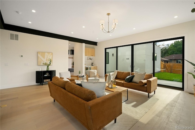 1601 S Columbine St, Denver, CO 80210 - living room featuring light wood-type flooring, a chandelier, recessed lighting, and baseboards