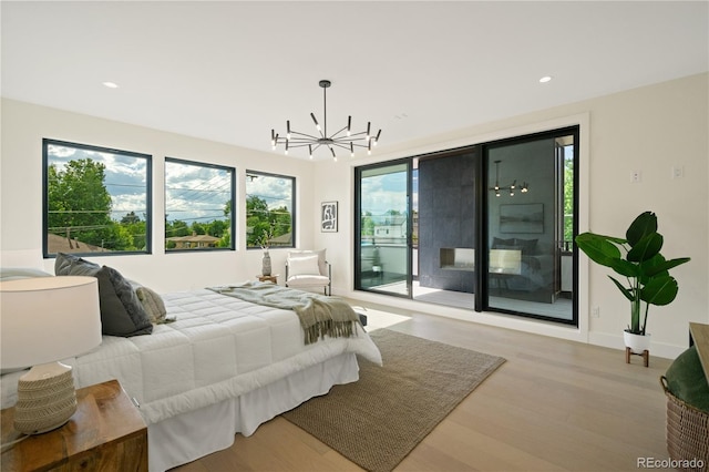 1601 S Columbine St, Denver, CO 80210 - bedroom featuring access to exterior, a chandelier, wood finished floors, and recessed lighting