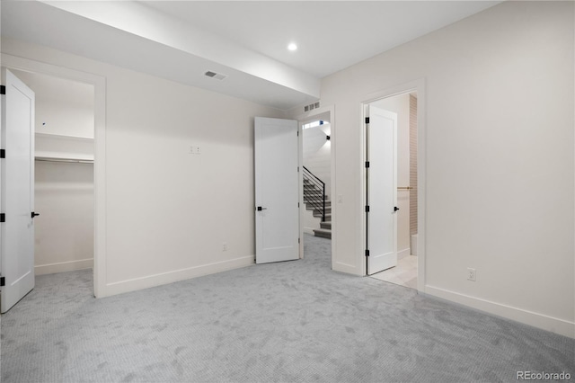 1601 S Columbine St, Denver, CO 80210 - unfurnished bedroom with a spacious closet, carpet floors, baseboards, recessed lighting, and a closet