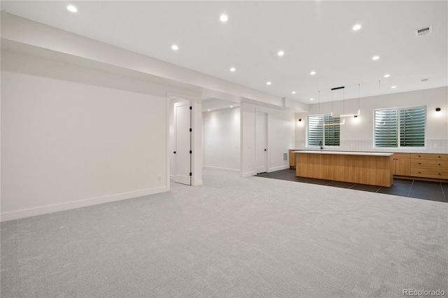 1601 S Columbine St, Denver, CO 80210 - unfurnished living room with dark colored carpet, recessed lighting, and baseboards