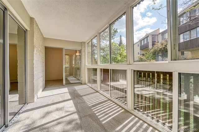 unfurnished sunroom featuring plenty of natural light