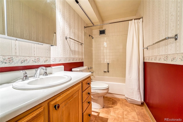 full bathroom featuring vanity, tile patterned flooring, toilet, and shower / bathtub combination with curtain