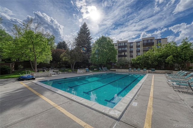 view of pool featuring a patio area