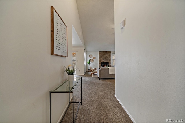 corridor featuring carpet flooring and baseboards